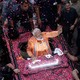 Narendra Modi waves to supporters in Varanasi in April.