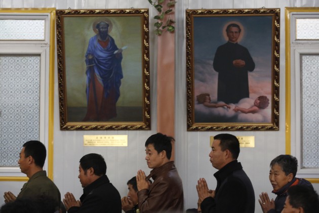 Believers wait to receive Communion at an underground Catholic church in Tianjin (Kim Kyung-Hoon / Reuters)