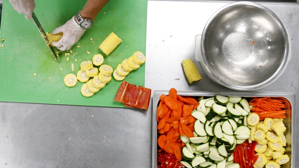A chef at Revolution Foods prepares school lunches for California children.