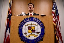 Hawaii Attorney General Douglas Chin speaks at a press conference after filing an amended lawsuit against Donald Trump's travel ban on March 9, 2017.