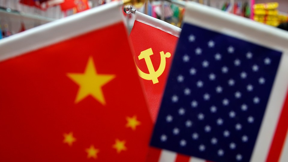 The flags of the U.S., China, and the Chinese Communist Party