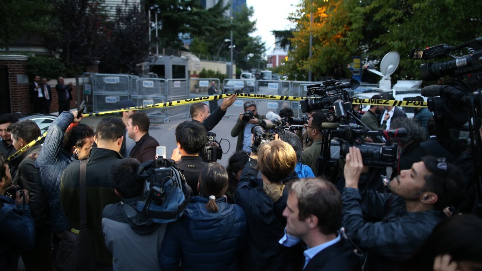 Journalists stand outside the blocked road to the Saudi consulate in Istanbul.