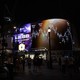 A chart from the James Webb Space Telescope is displayed on a digital billboard on a street at night.