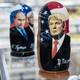A souvenir shopkeeper displays Matryoshka dolls featuring Russian President Vladimir Putin and US presidents, including Donald Trump, on December 3, 2019 in Moscow, Russia.