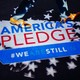Two feet are shown walking on an “America's Pledge” logo