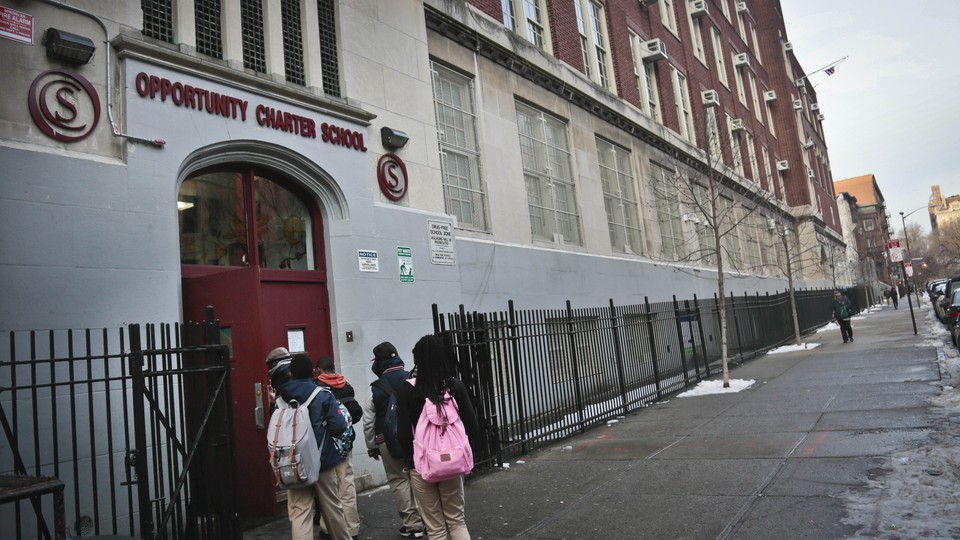 A group of students enters Opportunity Charter School in New York.