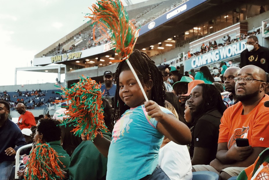 A young girl cheers for the Rattlers at a game between the Florida’s A&M Rattlers and Bethune Cookman’s Wildcats in Orlando, Florida. 