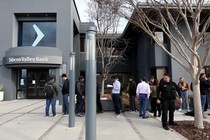 People line up outside a Silicon Valley Bank branch on March 13, 2023