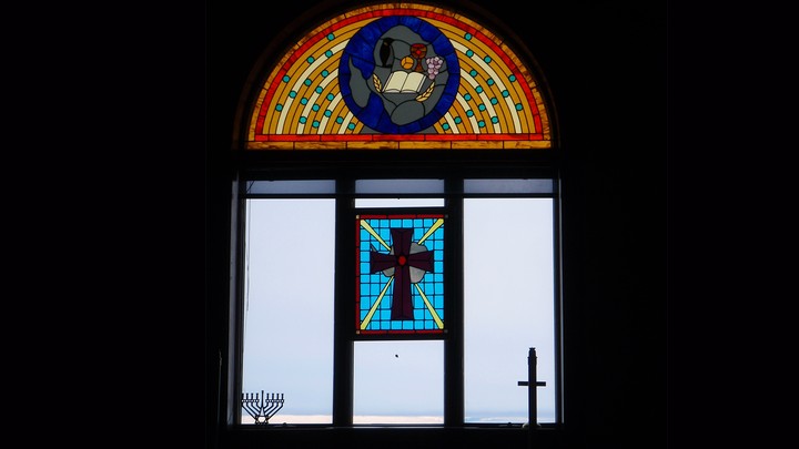A stained-glass window looking out onto an icy landscape