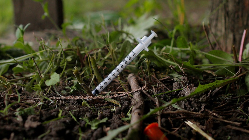 A syringe stuck into the ground