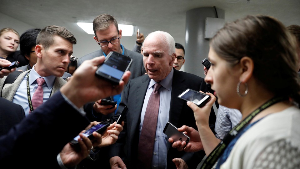 Senator John McCain speaks with reporters on Capitol Hill in Washington, D.C., in May 2017.