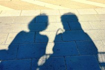 Shadow of two women talking