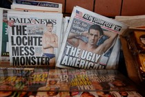 The front pages of the New York Post and the New York Daily News display the image of U.S. Olympic swimmer Ryan Lochte.