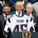 President Trump holds up a New England Patriots jersey during an event honoring the Super Bowl champions at the White House on April 19, 2017
