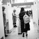 Photo of an air passenger from China walking through the COVID-19 testing booths at the Paris-Charles-de-Gaulle airport