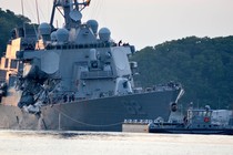 The U.S. Navy Arleigh Burke-class guided-missile destroyer USS Fitzgerald returns to base after a collision.