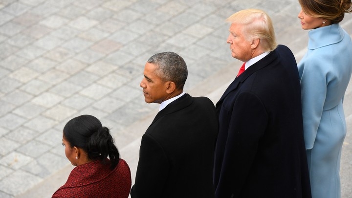 Michelle Obama, Barack Obama, Donald Trump, and Melania Trump stand together.