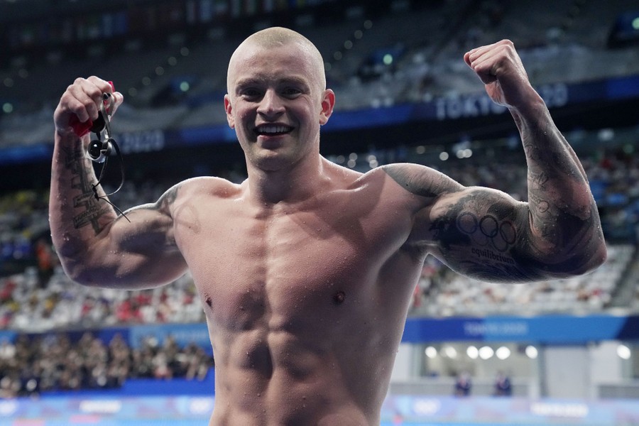 Adam Peaty of Britain reacts after winning the men's 100-meter-breaststroke final at the Tokyo Aquatics Centre on July 26, 2021.