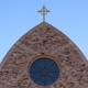The cross atop Ave Maria Catholic Church, centrally located in Ave Maria, Florida, and across the street from Ave Maria University’s academic buildings