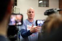 The congressional candidate J. D. Scholten talks to reporters.