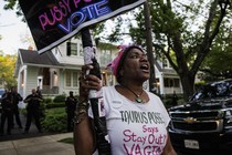 Nadine Seiler holds a sign near the home of Supreme Court Justice Brett Kavanaugh in Chevy Chase, Maryland