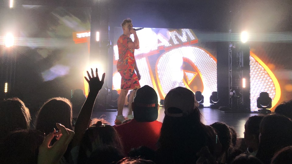 Jake Paul on stage holding a microphone