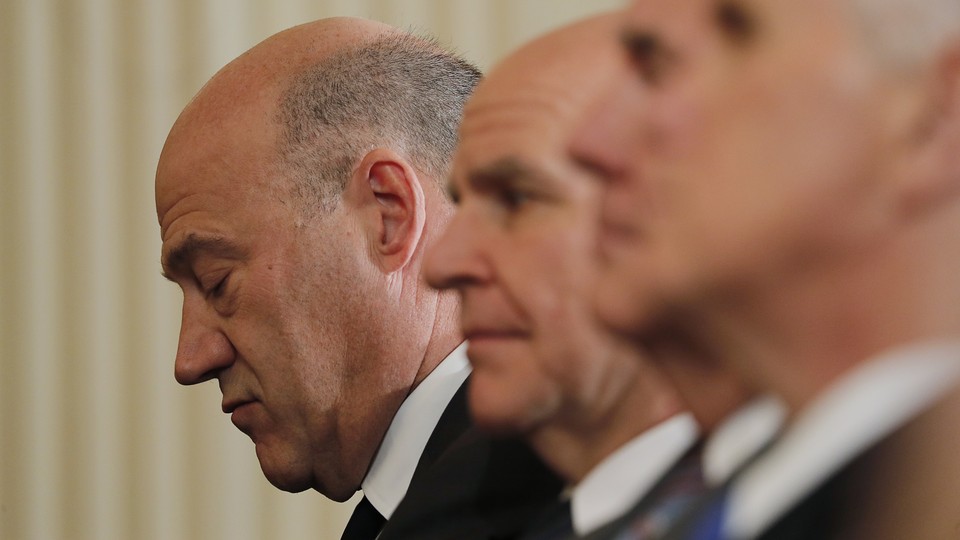Gary Cohn looks downcast next to senior White House officials
