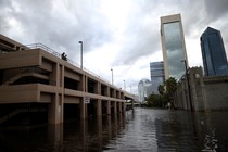 A couple looks at flood waters in Jacksonville, Florida on Monday, September 11, 2017.