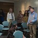 Tim Robinson stands in the middle of a conference room, drenched in water, while others stand around him, staring, in "I Think You Should Leave"