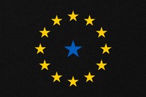 A circle of yellow stars around a blue star against a black field