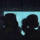 silhouettes of refugees on a bus