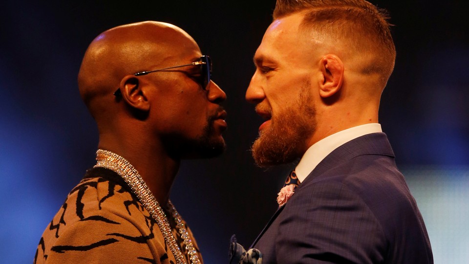 Floyd Mayweather and Conor McGregor appear in a press conference in London.
