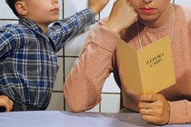 parent reading a child's report card
