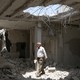 A man walks amid rubble at a damaged site in the province of Daraa, Syria.