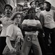 Young Guardian Angels line up on the stairs in a New York City subway station.