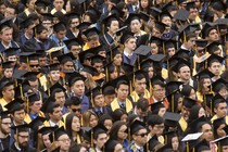 A sea of graduates in caps and gowns