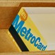 A stack of MTA metro cards in a cardboard box