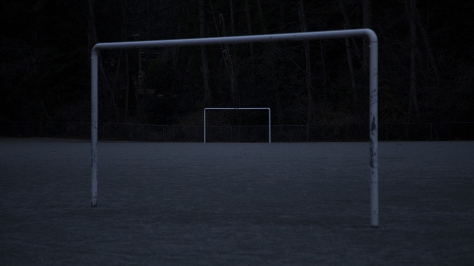 An abandoned soccer field in the dark