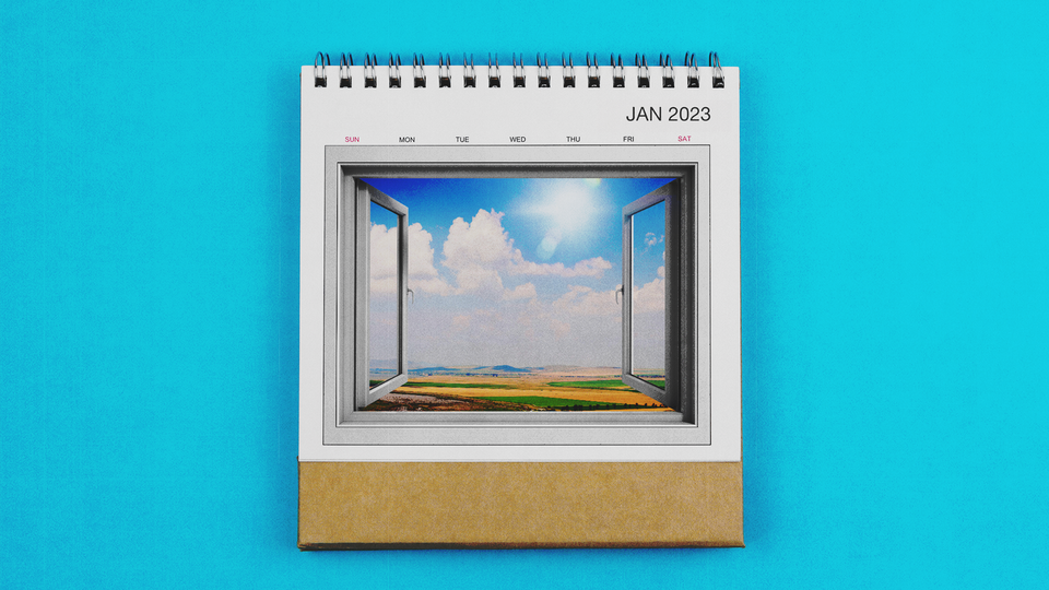 A January 2023 calendar, with an image of a window opening to a sunny day