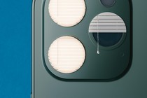 photo illustration of back of smartphone with 3-lens camera where 2 of the lens circles are covered by closed window blinds and the third lens is covered with half-open window blinds