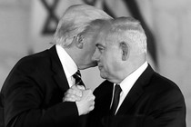 Trump clasps Netanyahu's hand and leans close to speak in his ear.