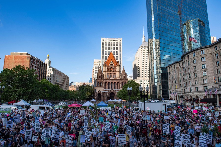 A large crowd of protesters in a city square