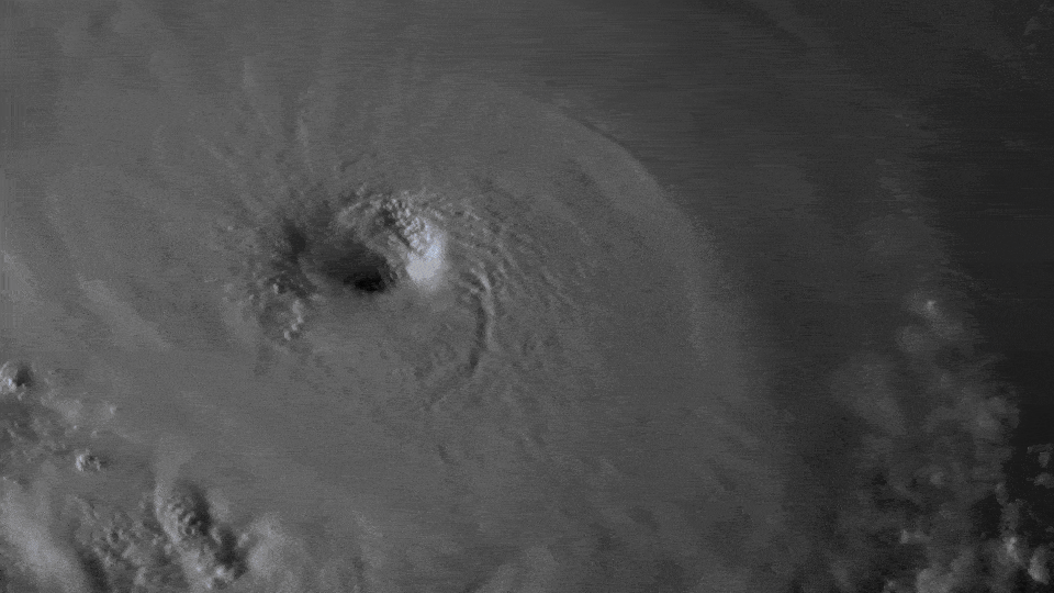 A black-and-white animation of the churning eye wall of Hurricane Florence, surrounded by convective clouds