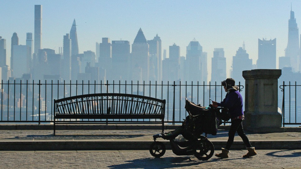photo of a woman pushing a stroller