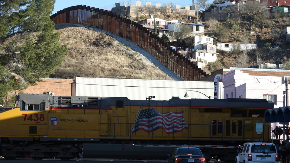 A freight train crosses into the U.S. across the border with Mexico in Nogales.
