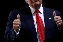 Trump gives thumbs-up.