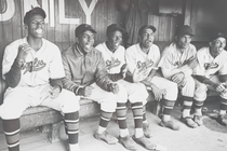 The Newark Eagles, a Negro-league baseball team, photographed in a dugout