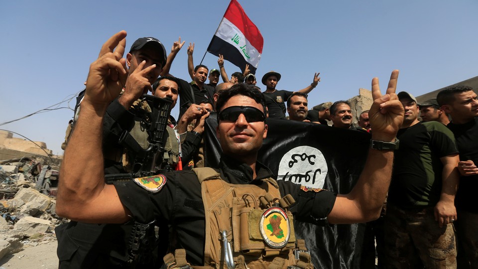 Iraqi Counter Terrorism Service (CTS) celebrate in the Old City of Mosul.