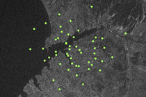 Green dots spread over a satellite view of Ukraine.