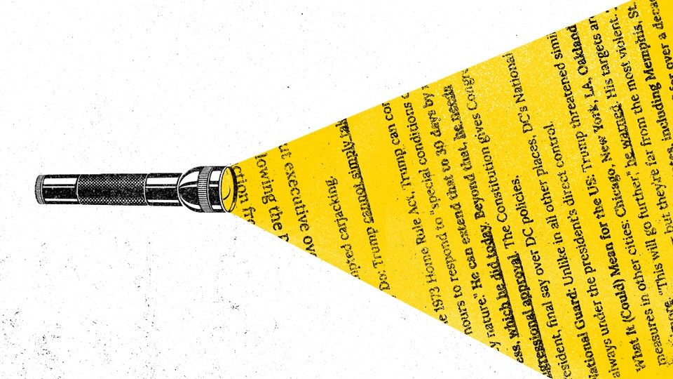 A flashlight shines on text.